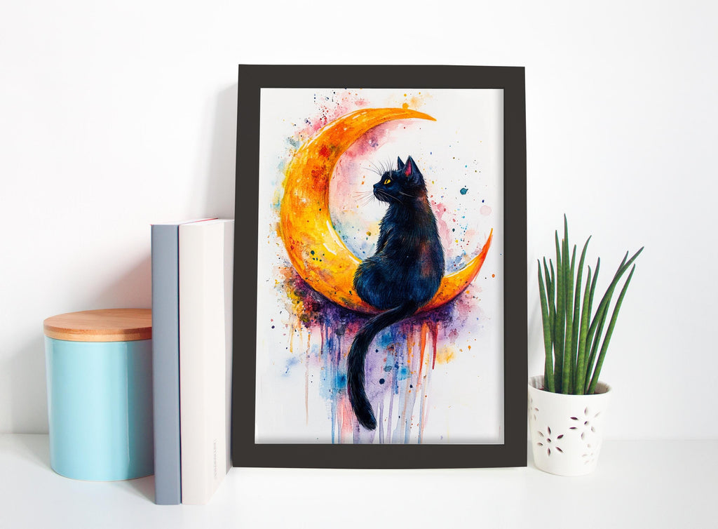 A framed painting of a black cat sitting on a crescent moon, surrounded by splashes of color, is displayed on a white shelf next to a blue container and a potted plant.