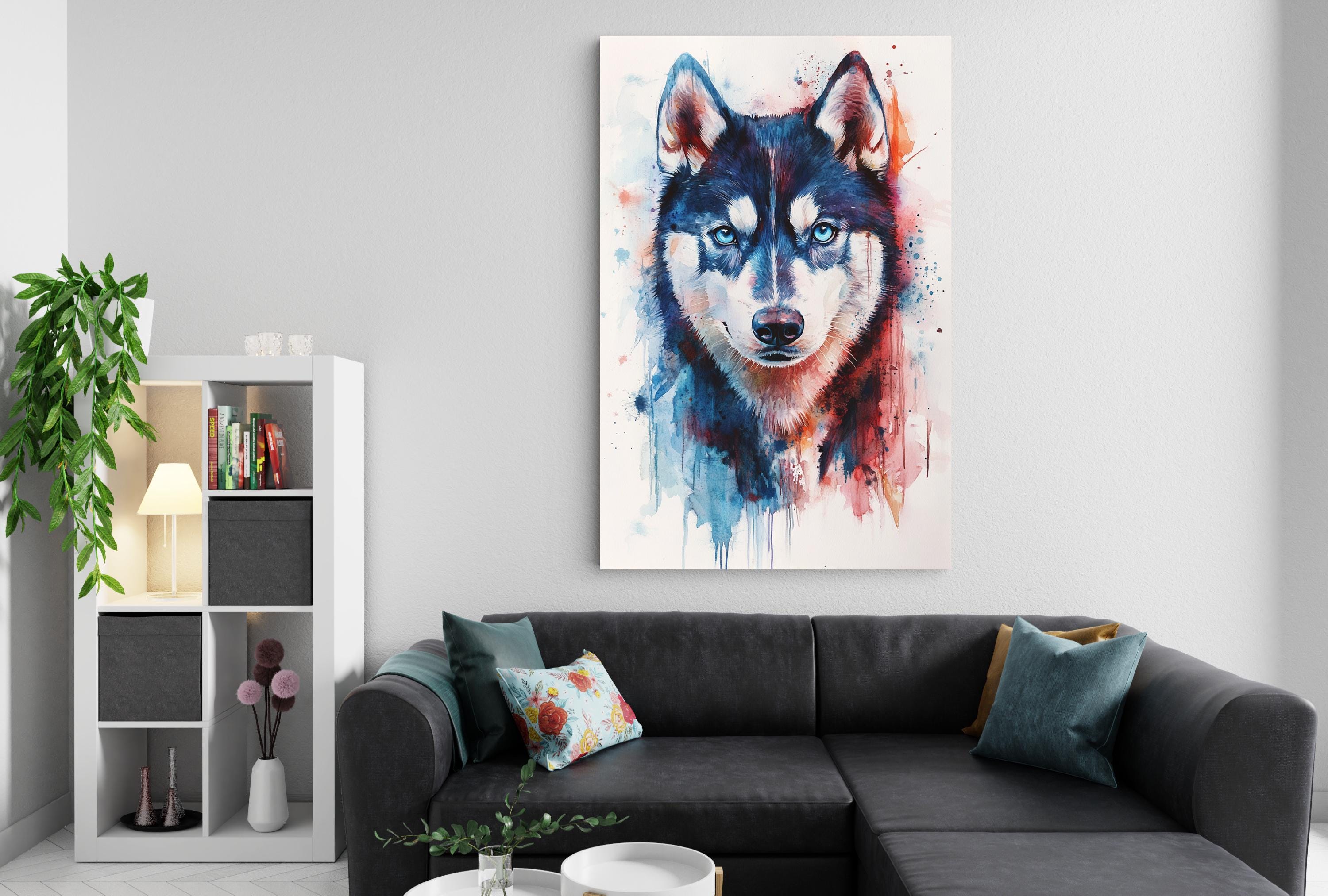 a large, colorful painting of a wolf's face hanging on a wall above a black couch in a living room setting.