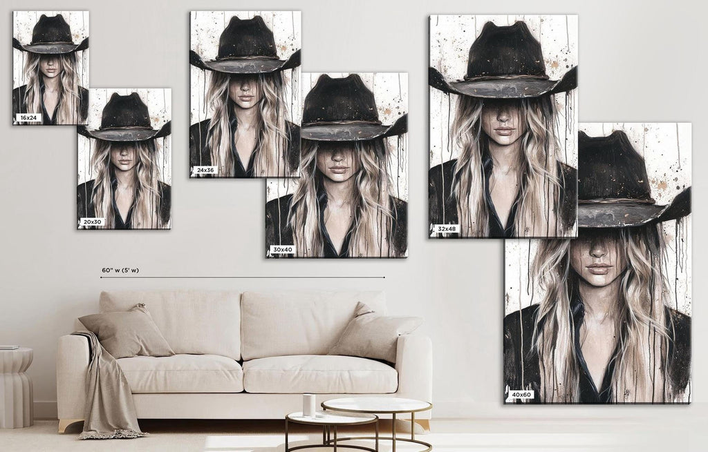 a living room with a couch and a wall mounted picture of a woman wearing a