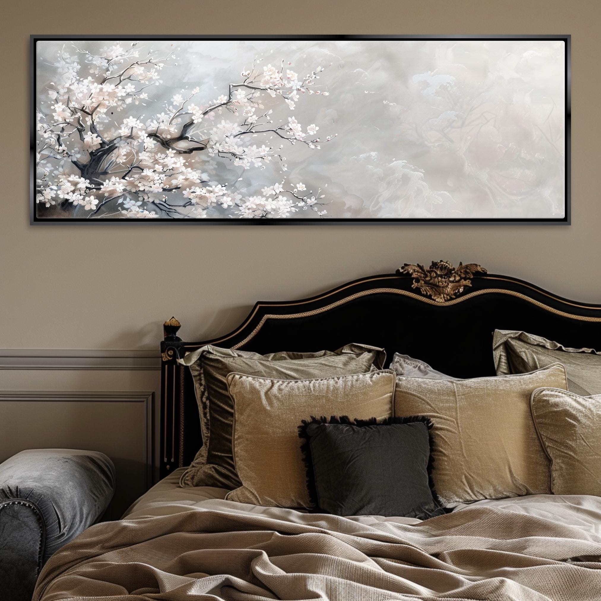 a bed with a large painting on the wall above it