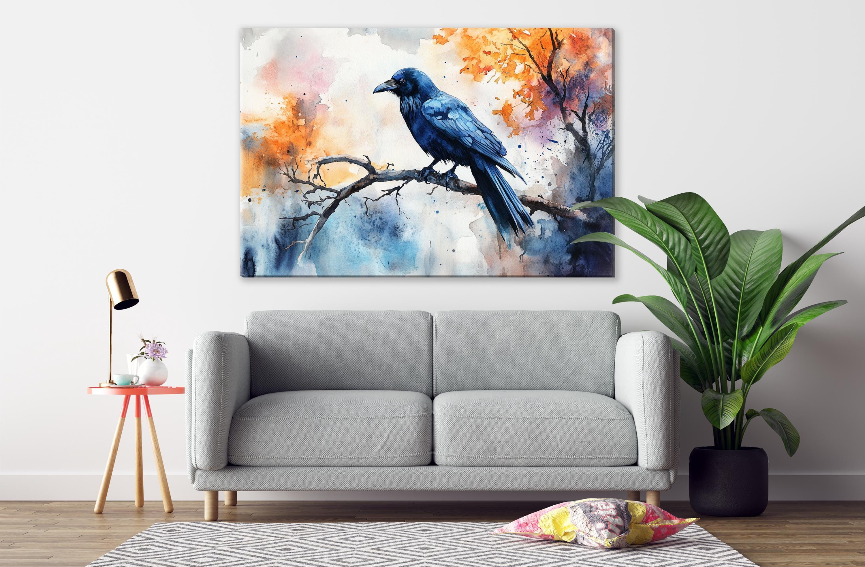 a gray sofa in a living room with a large painting of a blue bird perched on a branch hanging above it.