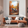 a cozy living room with a large painting of a cabin in the woods hanging on the wall above a brown sofa with pillows.