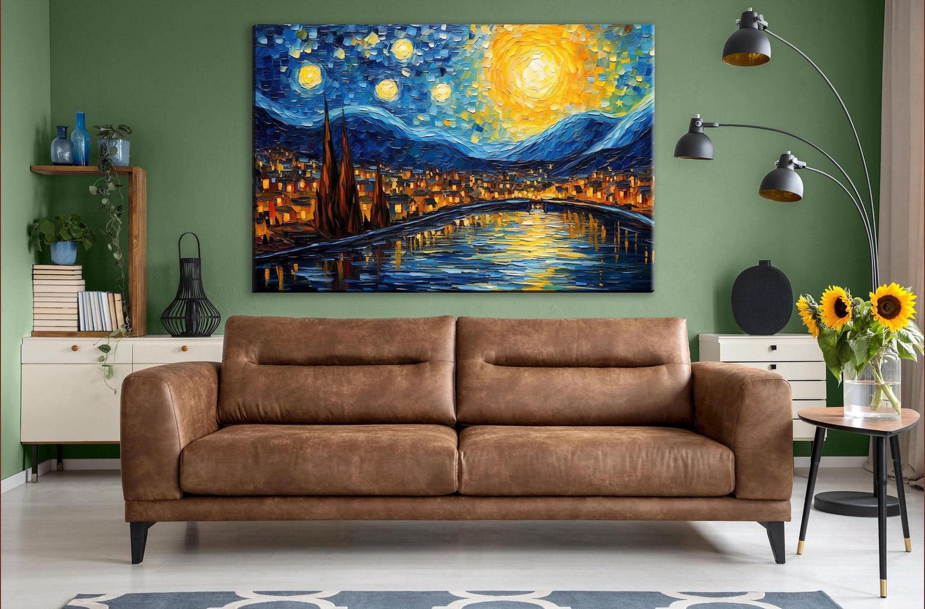 a large, vibrant painting of a cityscape with a starry night sky above, hanging on a green wall above a brown leather couch in a cozy living room setting.