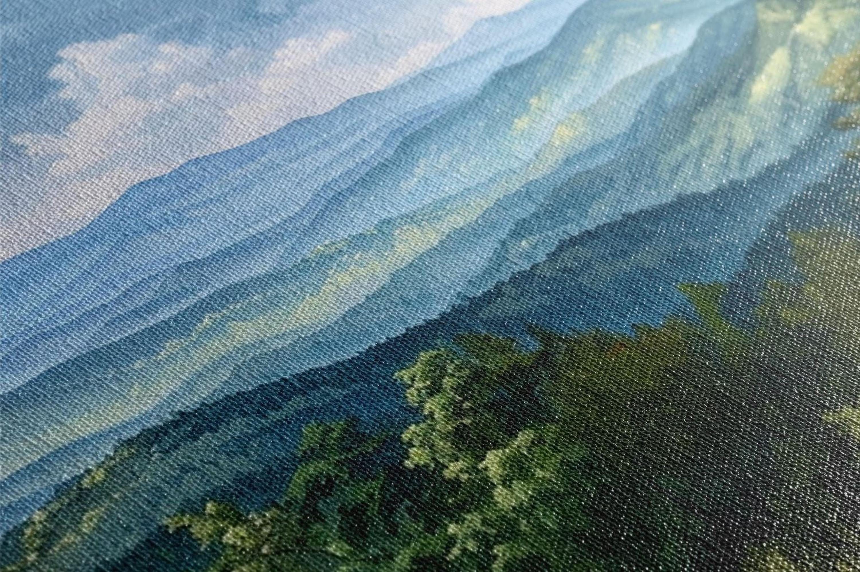 The image is a close-up of a painting depicting a mountainous landscape with a blend of blue and green colors, creating a sense of depth and texture.