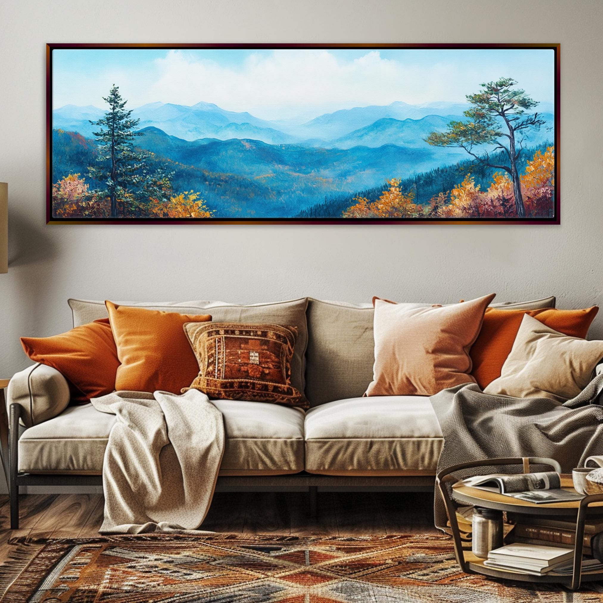 a living room with a couch and a painting on the wall