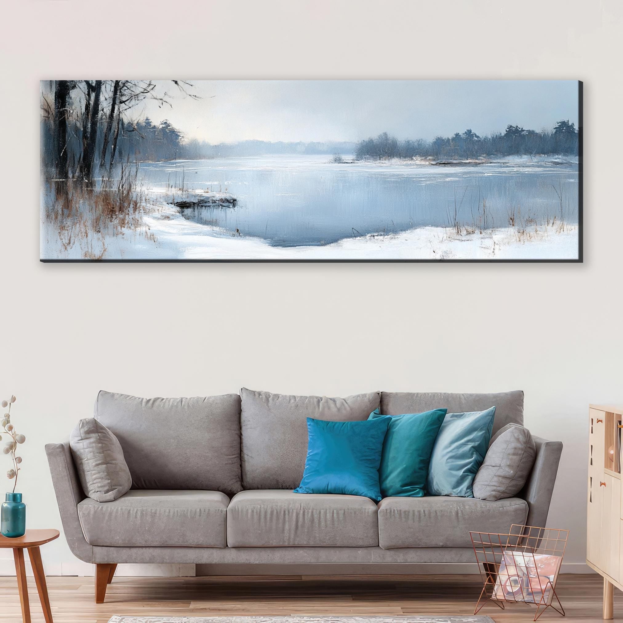 a living room with a couch and a painting on the wall