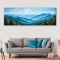 a living room with a couch and a painting on the wall