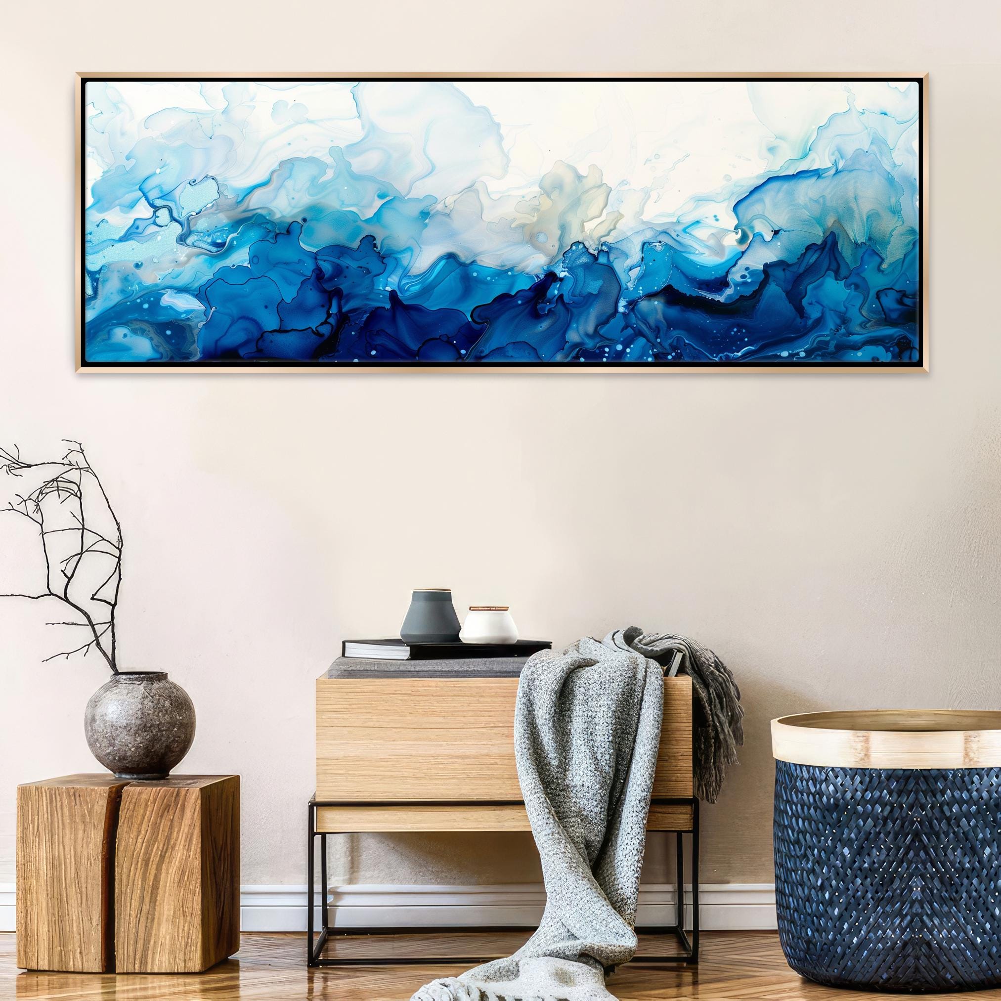 a painting hanging on a wall above a table