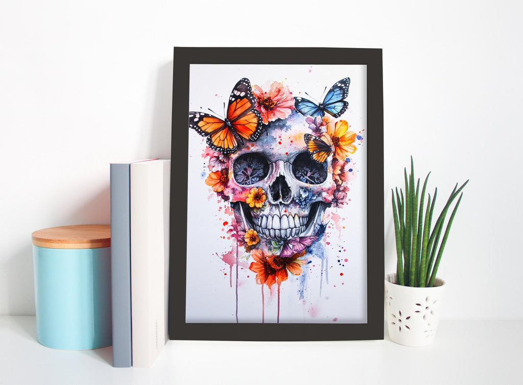 a framed artwork depicting a colorful skull surrounded by butterflies and flowers, placed on a shelf next to a blue container and a potted plant.