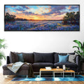 a living room with a couch and a painting on the wall