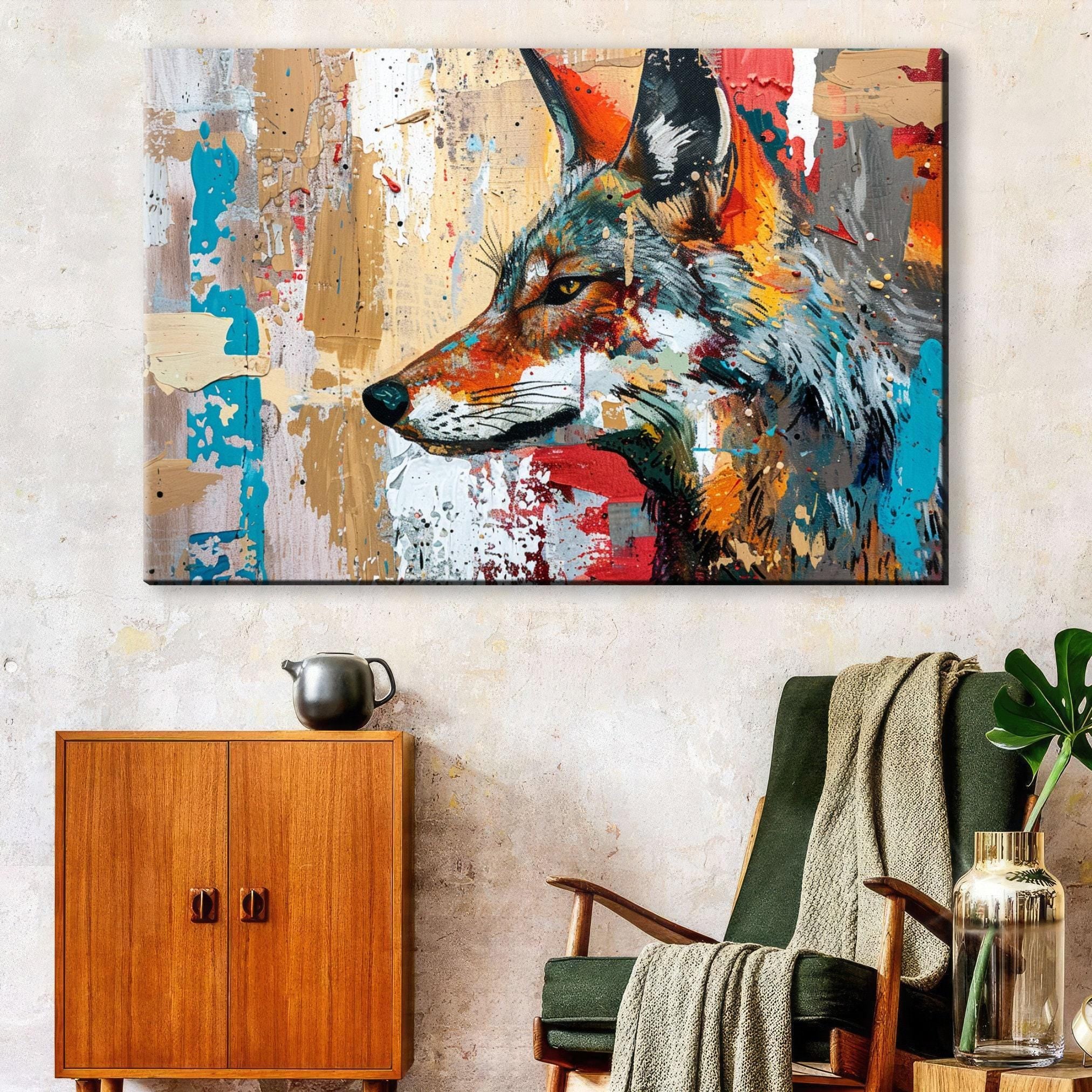 a large, colorful painting of a fox's head hanging on a wall above a wooden cabinet.