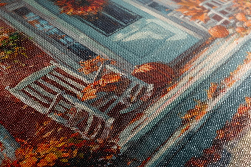 The image is a close-up of a painting depicting a porch with a rocking chair and a pumpkin, surrounded by autumn foliage.