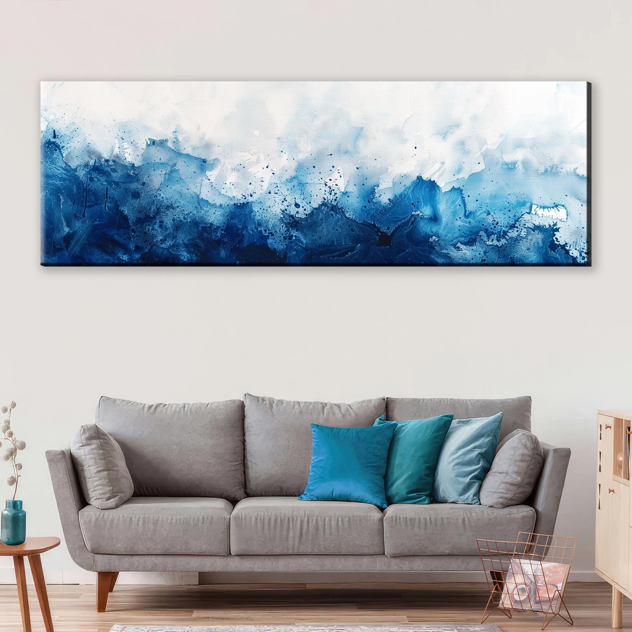 a living room with a couch and a painting on the wall