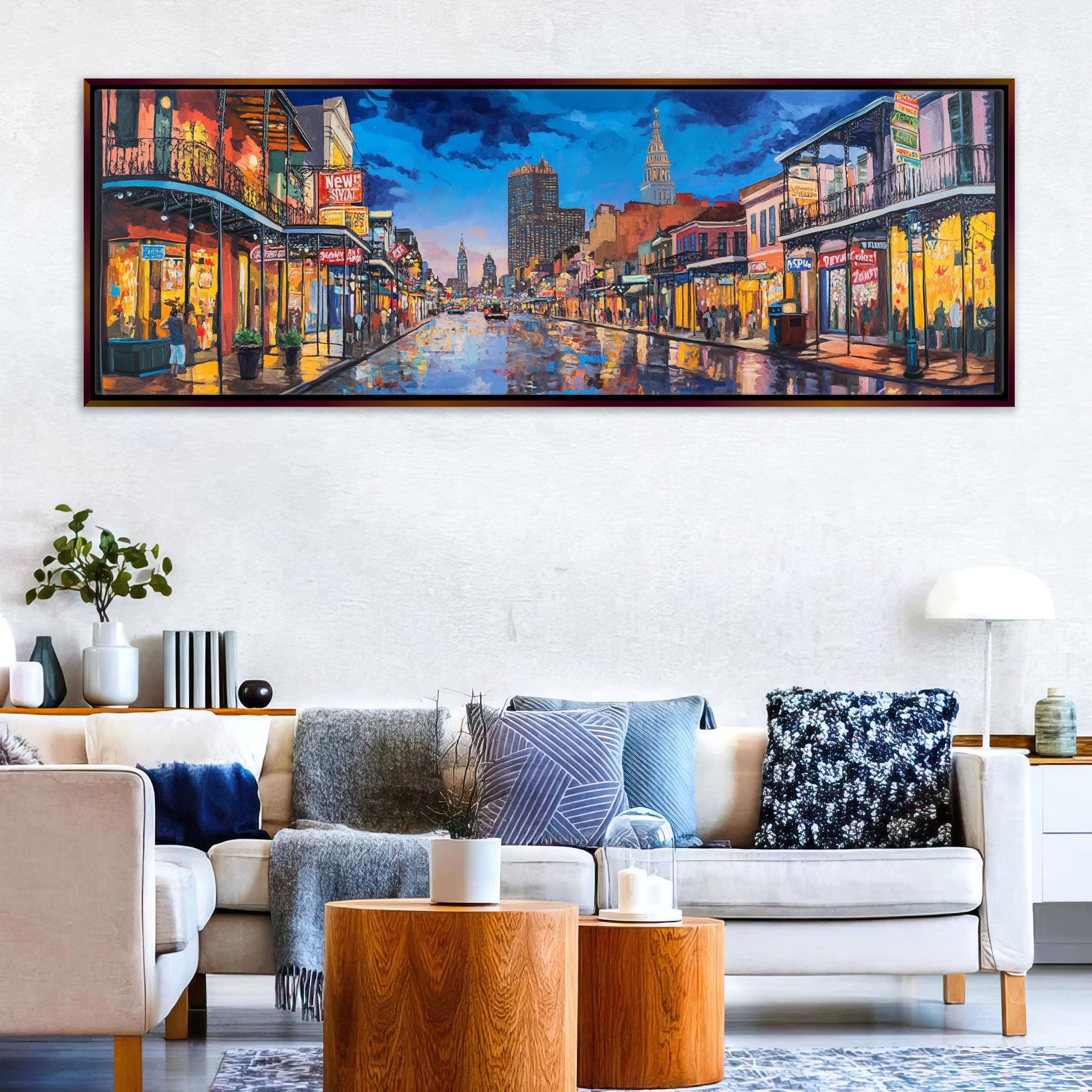a living room with a couch and a painting on the wall