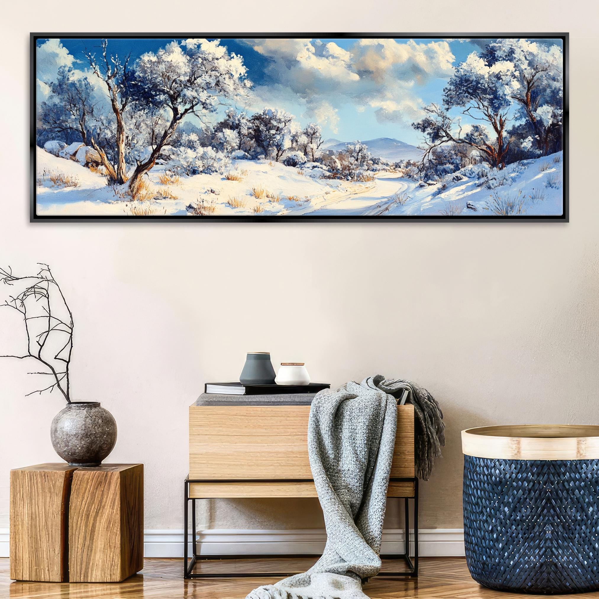 a painting of a snowy landscape on a wall