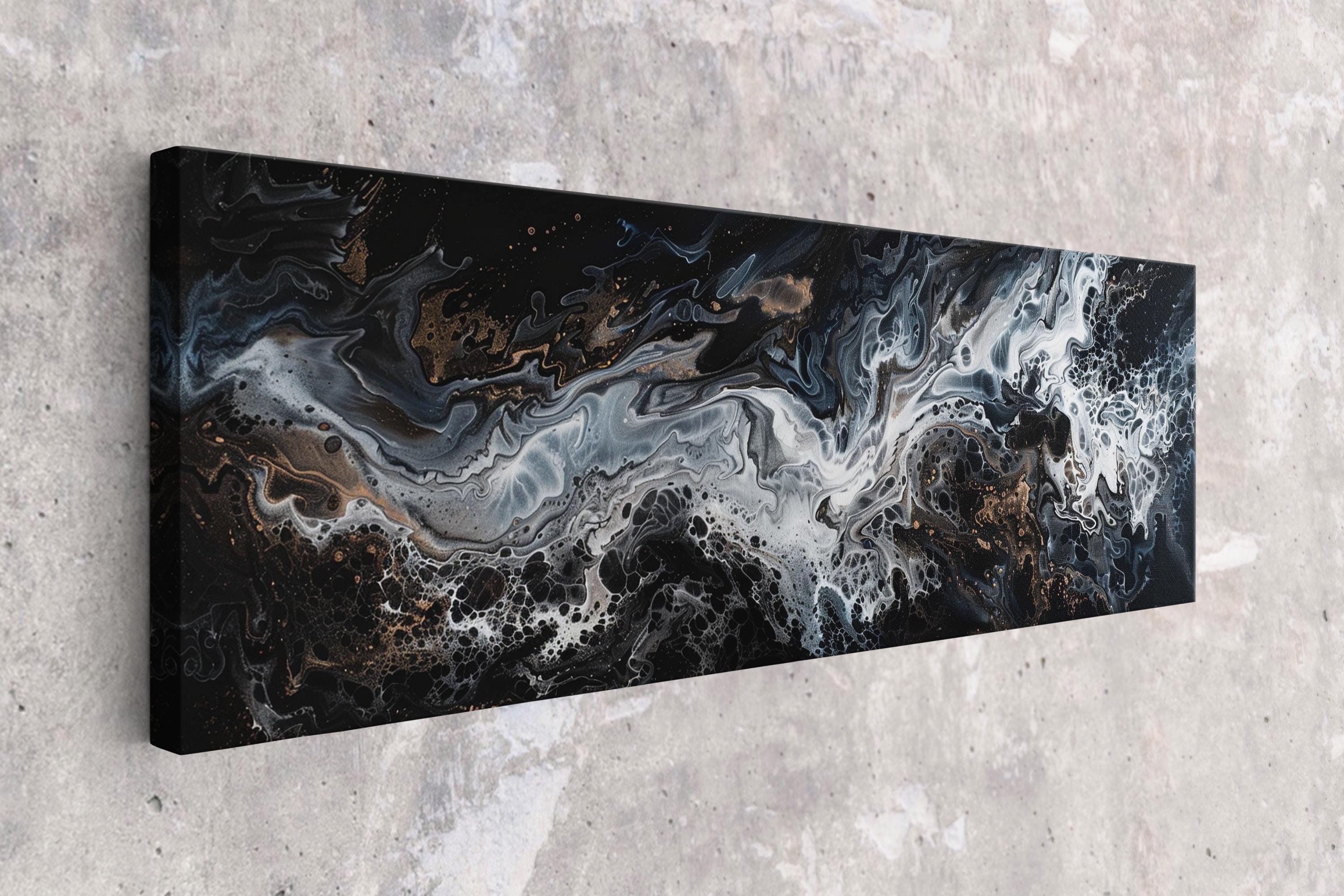 a black and white painting hanging on a wall