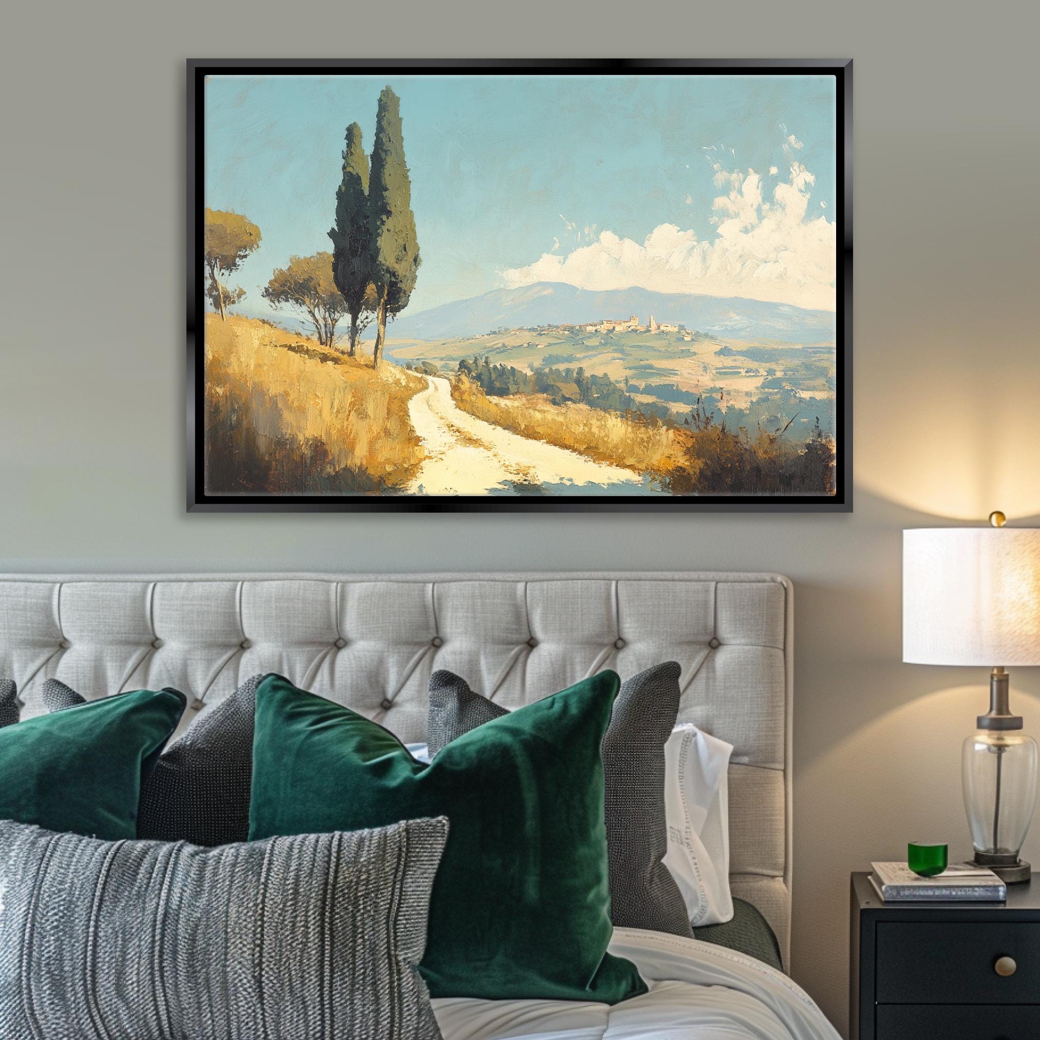 a bedroom with a bed and a painting on the wall