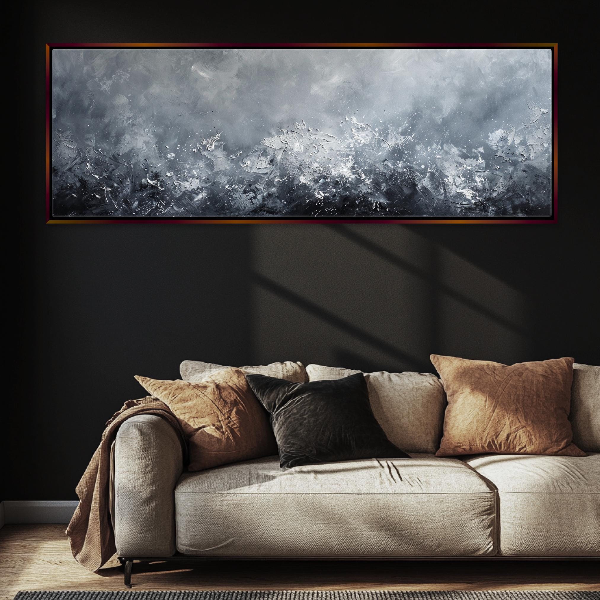 a living room with a couch and a painting on the wall