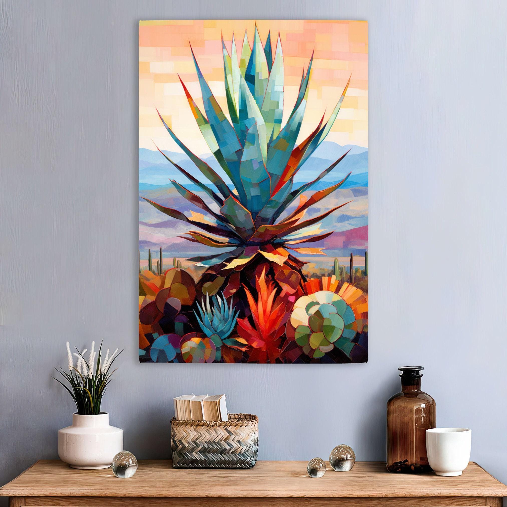 a vibrant, abstract painting of a cactus plant with a colorful, geometric design. The painting is displayed on a wall above a wooden table, which has various decorative items such as a vase, a bottle, and a small woven basket.