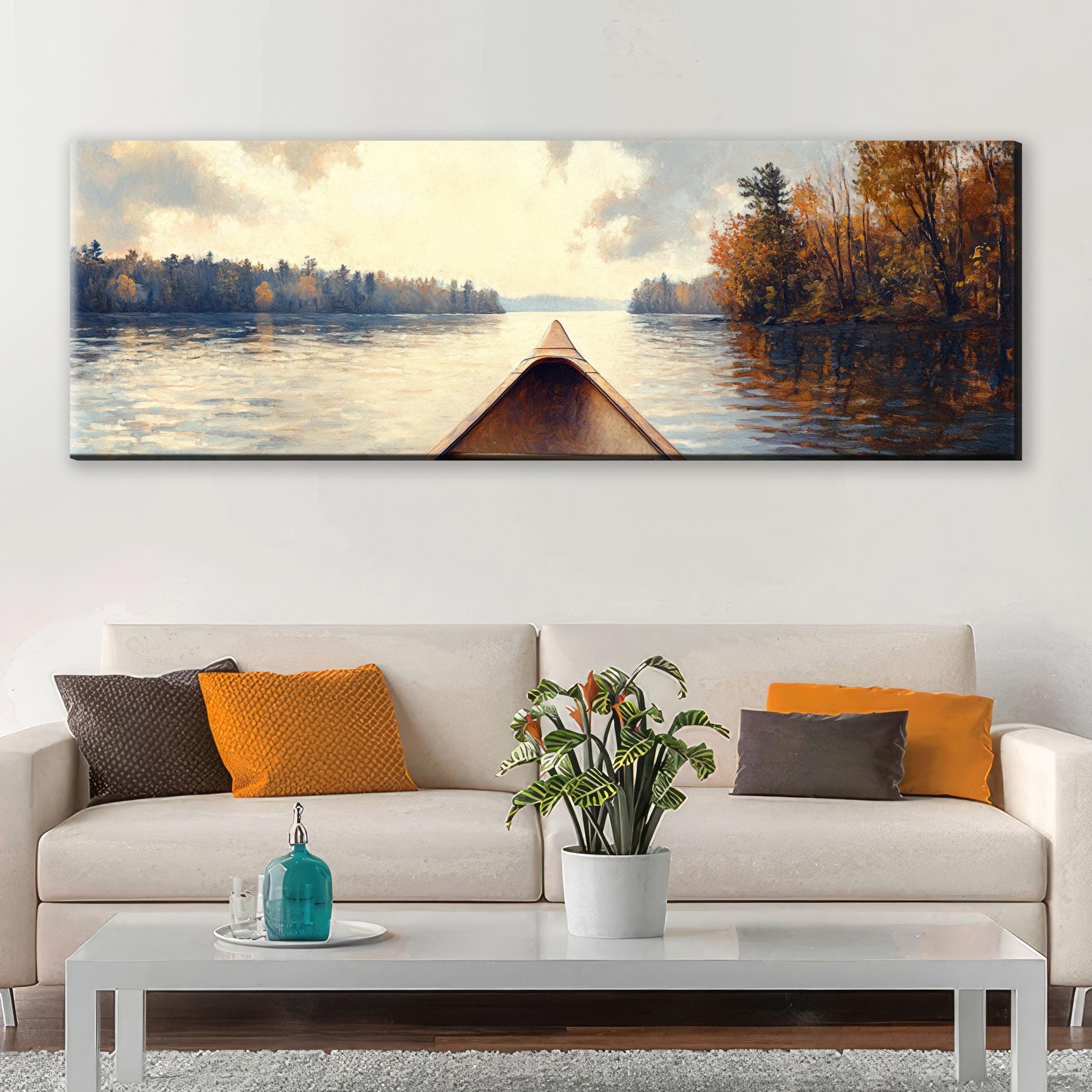 a living room with a couch and a painting on the wall