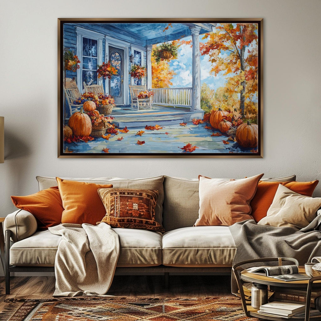 a cozy living room with a large painting of a porch adorned with pumpkins and autumn leaves hanging on the wall above a beige sofa with orange and beige throw pillows.