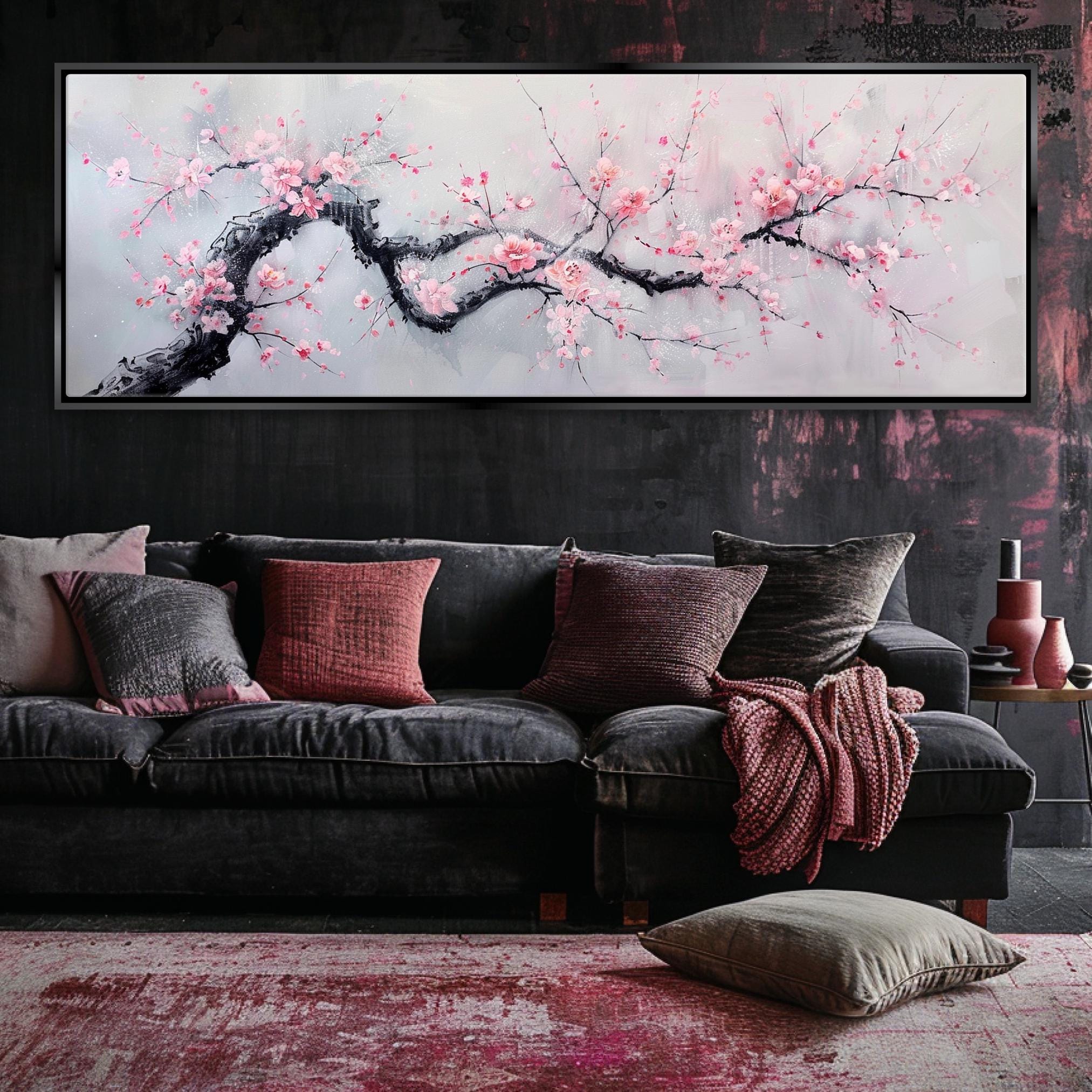 a living room with a couch and a painting on the wall