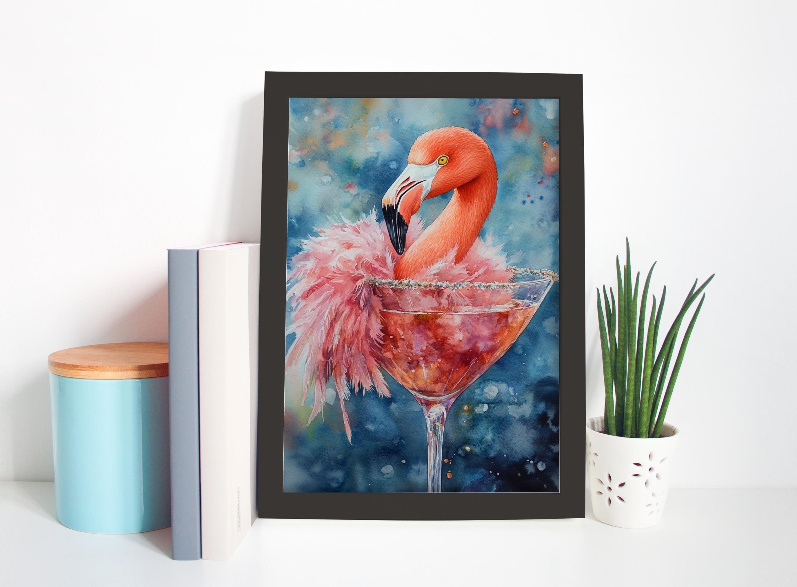 a framed painting of a flamingo sitting in a martini glass, surrounded by a blue and white color scheme.