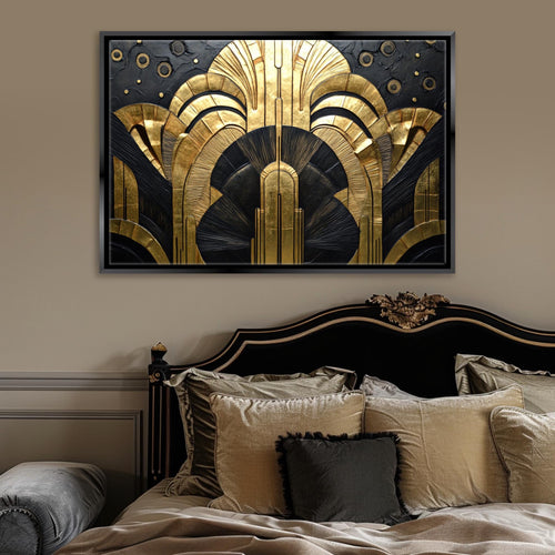 a bed with a black headboard and a gold and black painting on the wall