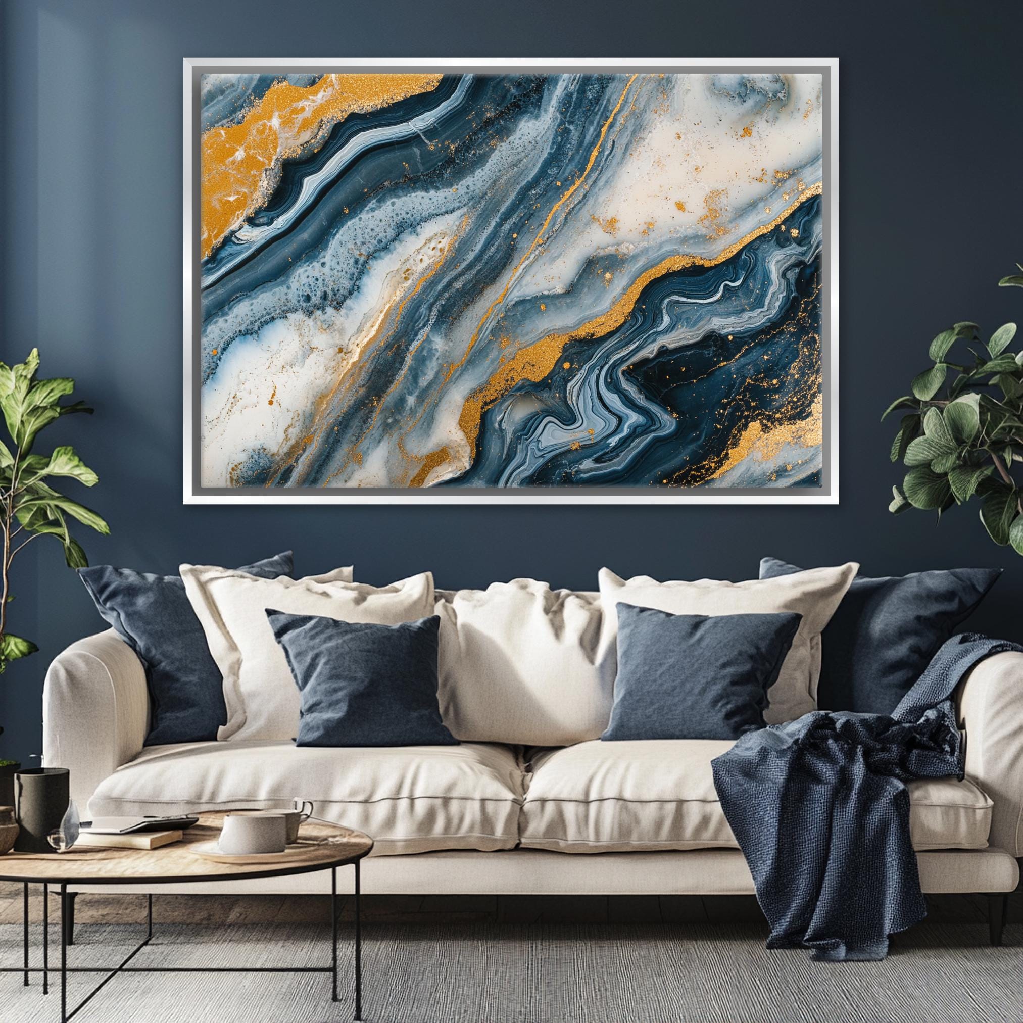 a living room with a couch and a painting on the wall