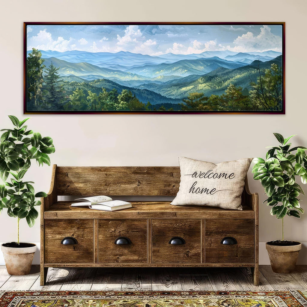 a large wooden bench with a "welcome home" pillow, surrounded by potted plants and a framed landscape painting depicting a mountainous, forested area.