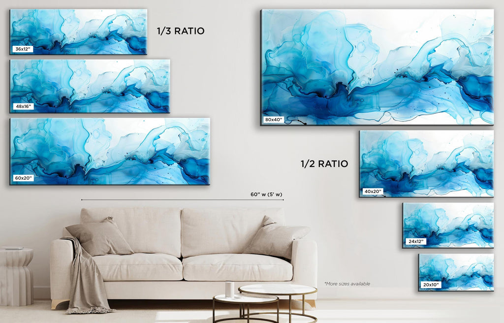 a living room with a couch and paintings on the wall