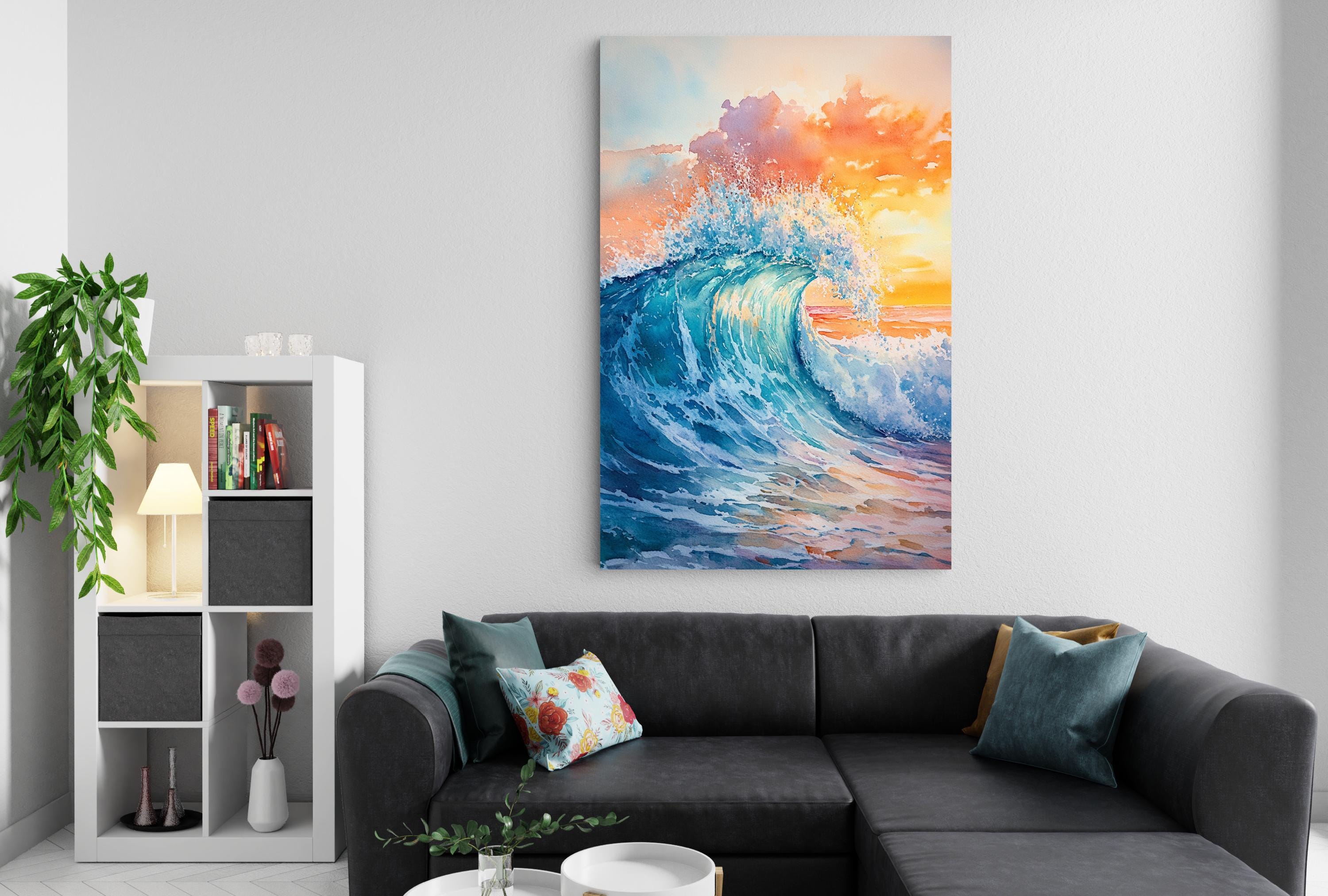 a living room with a large, vibrant painting of a crashing wave hanging on the wall above a black sectional sofa. The painting features a mix of blue, orange, and white colors, creating a dynamic and energetic scene. The room also includes a bookshelf, a potted plant, and a coffee table with decorative items, contributing to a cozy and inviting atmosphere.