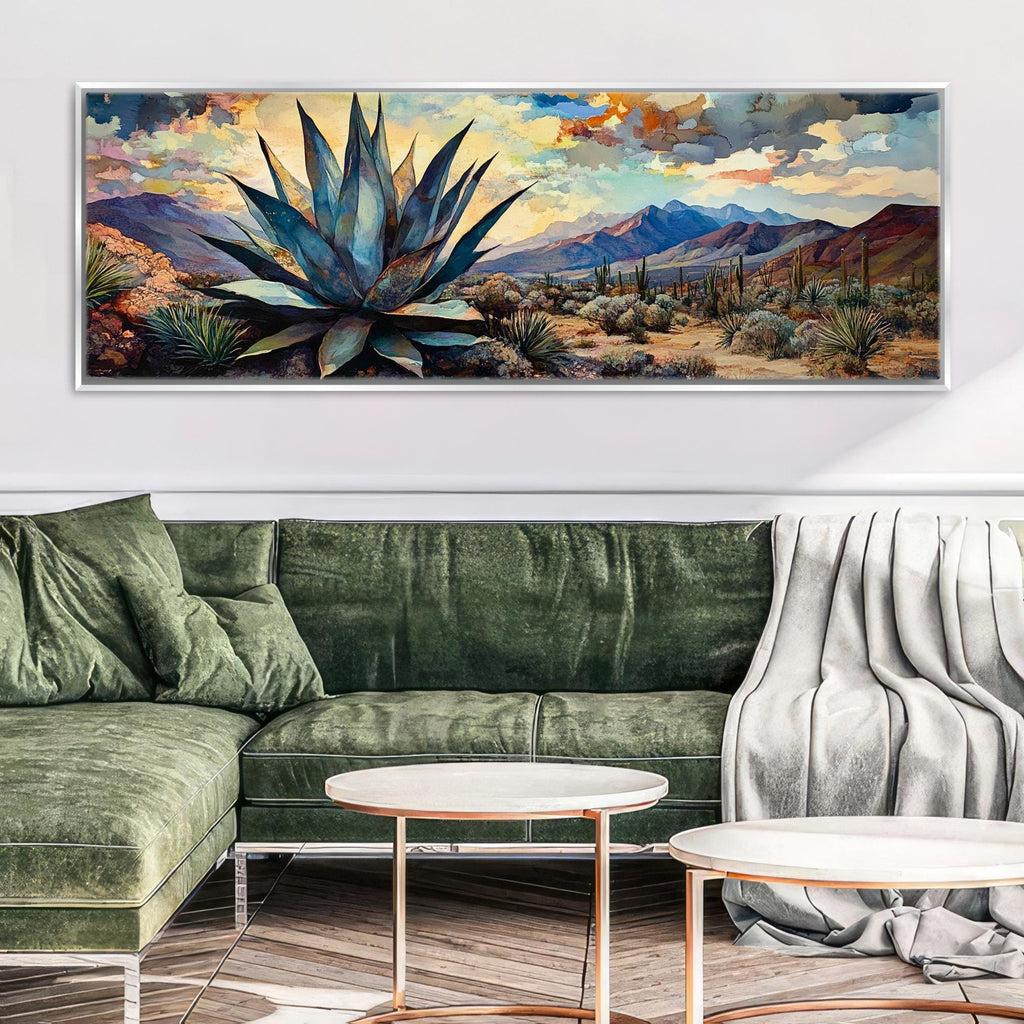 a living room with a green couch and a painting on the wall