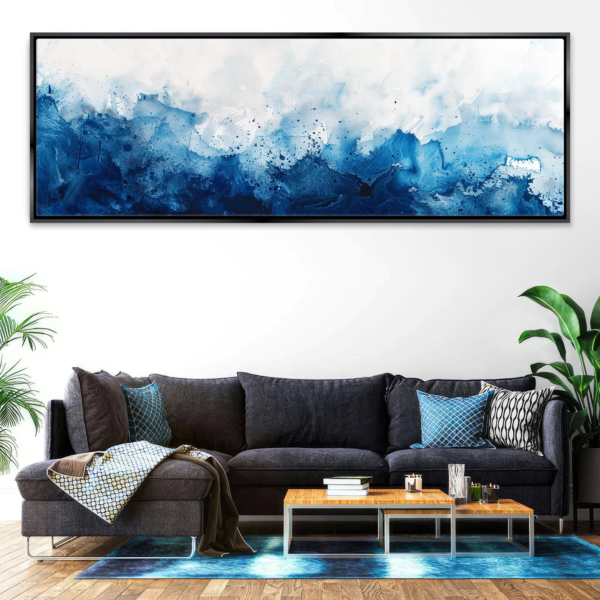 a living room with a couch and a painting on the wall