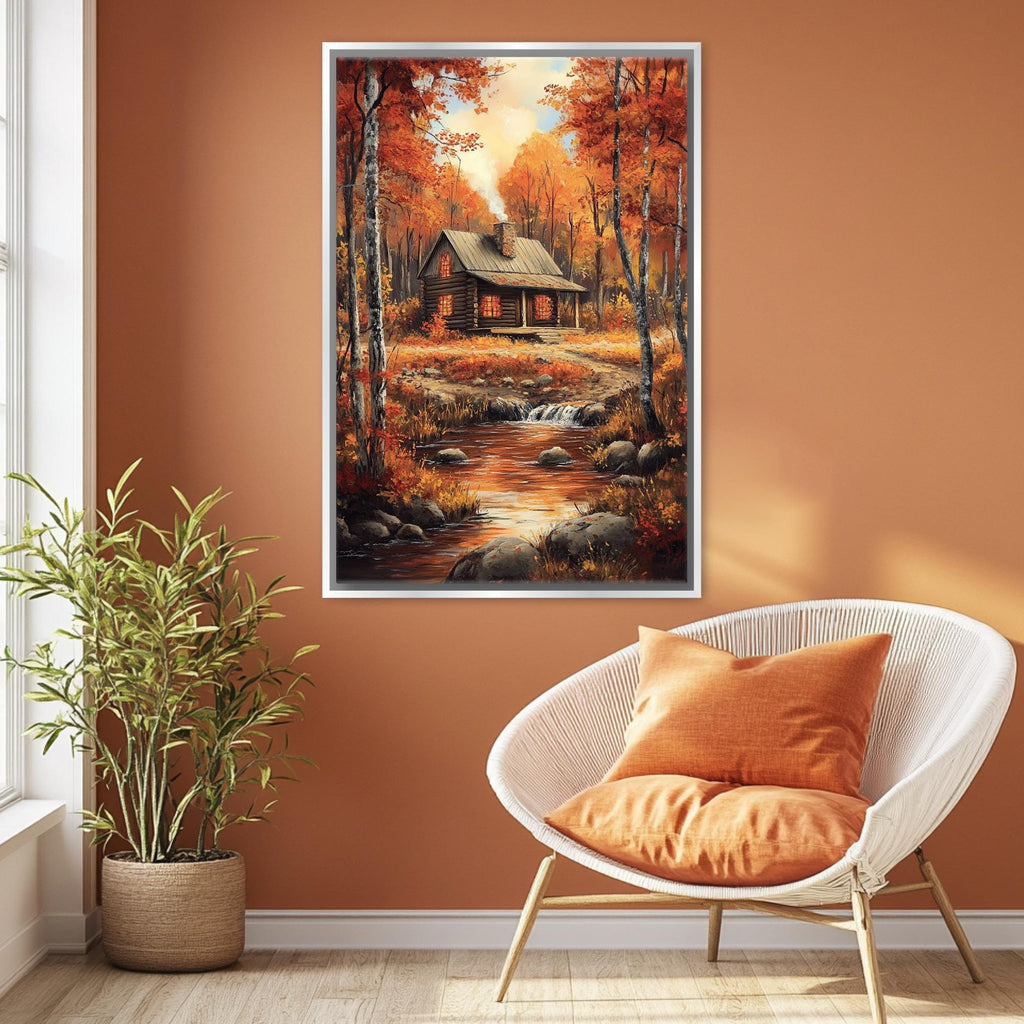 a cozy cabin nestled in a picturesque autumn landscape, with a stream running through the scene. The cabin is surrounded by vibrant fall foliage, creating a warm and inviting atmosphere. The cabin is situated on a hill, offering a panoramic view of the surrounding trees and landscape. The image is framed and hung on the wall, adding a touch of rustic charm to the room.