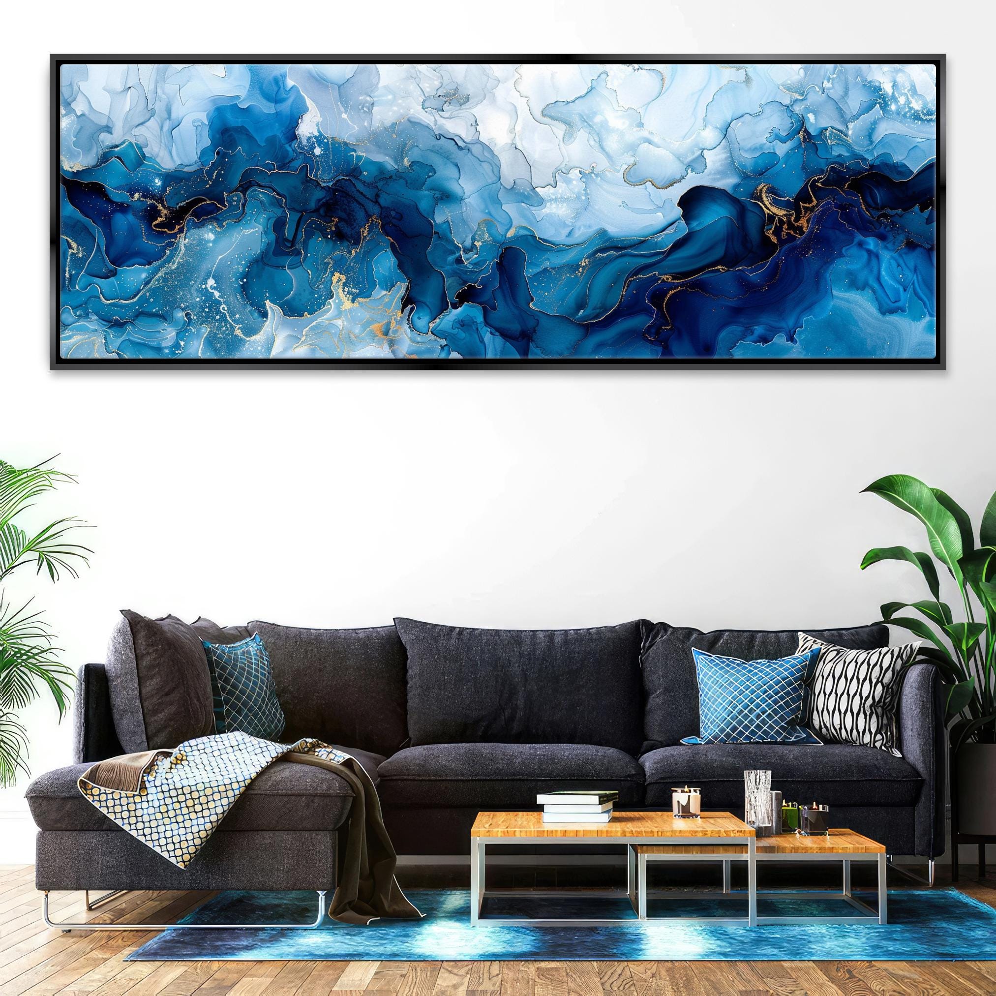 a living room with a couch and a painting on the wall