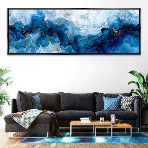 a living room with a couch and a painting on the wall