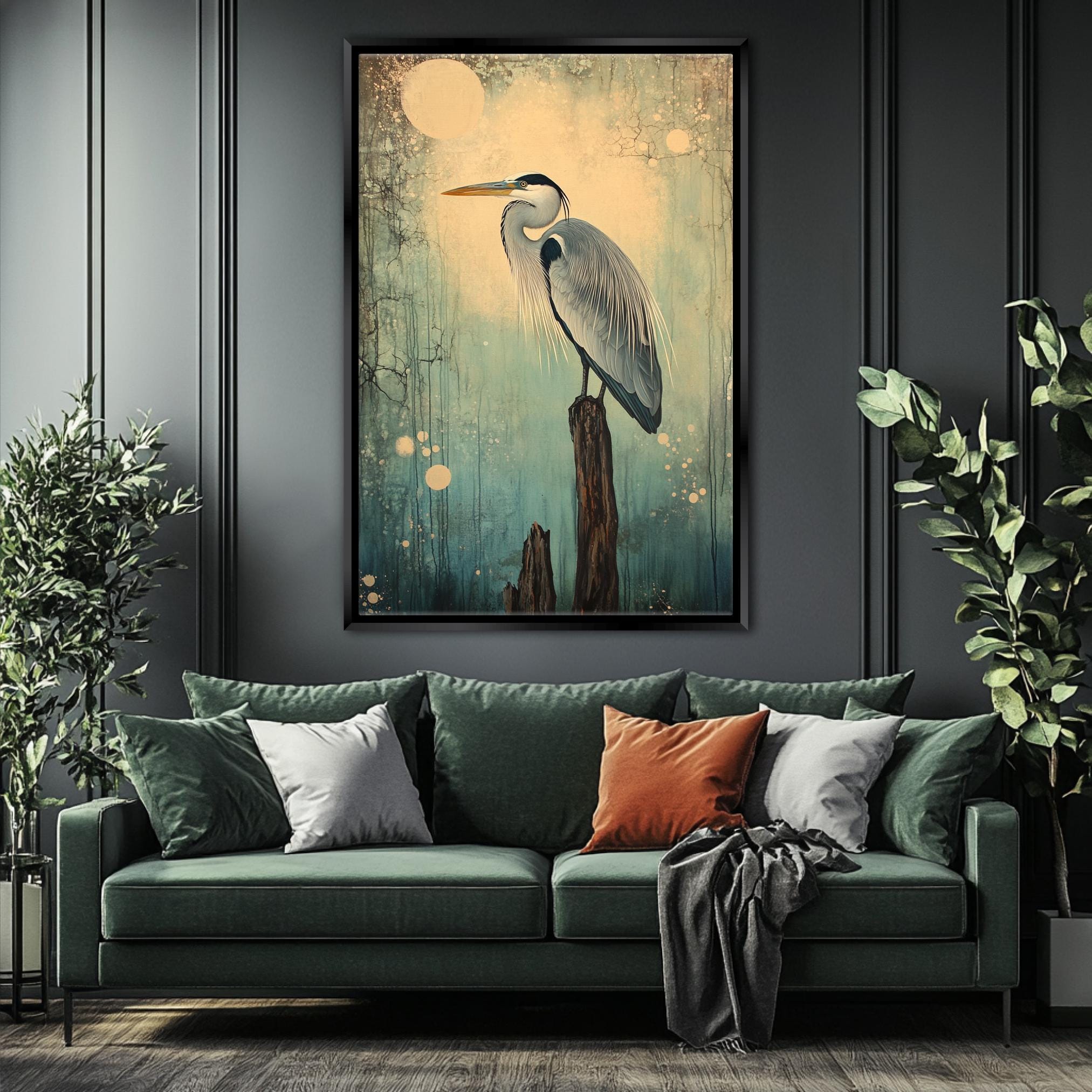 a living room with a green couch and a painting on the wall