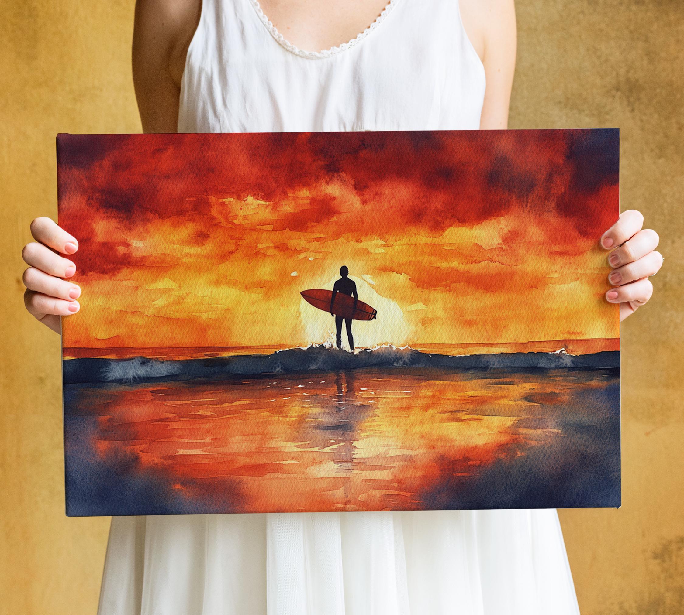 A person is holding a framed painting depicting a surfer standing on a beach at sunset.