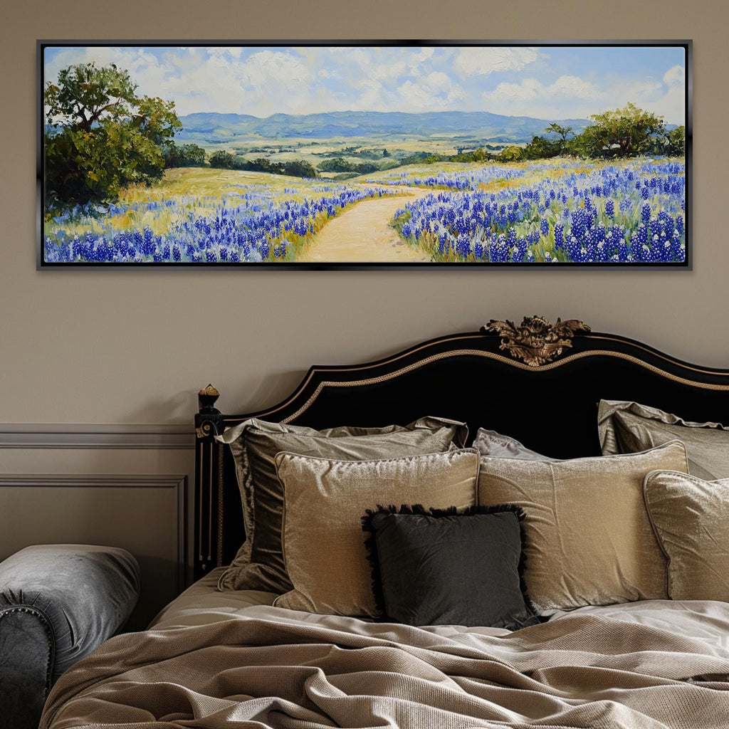 a painting of a field of bluebonnets on a wall above a bed