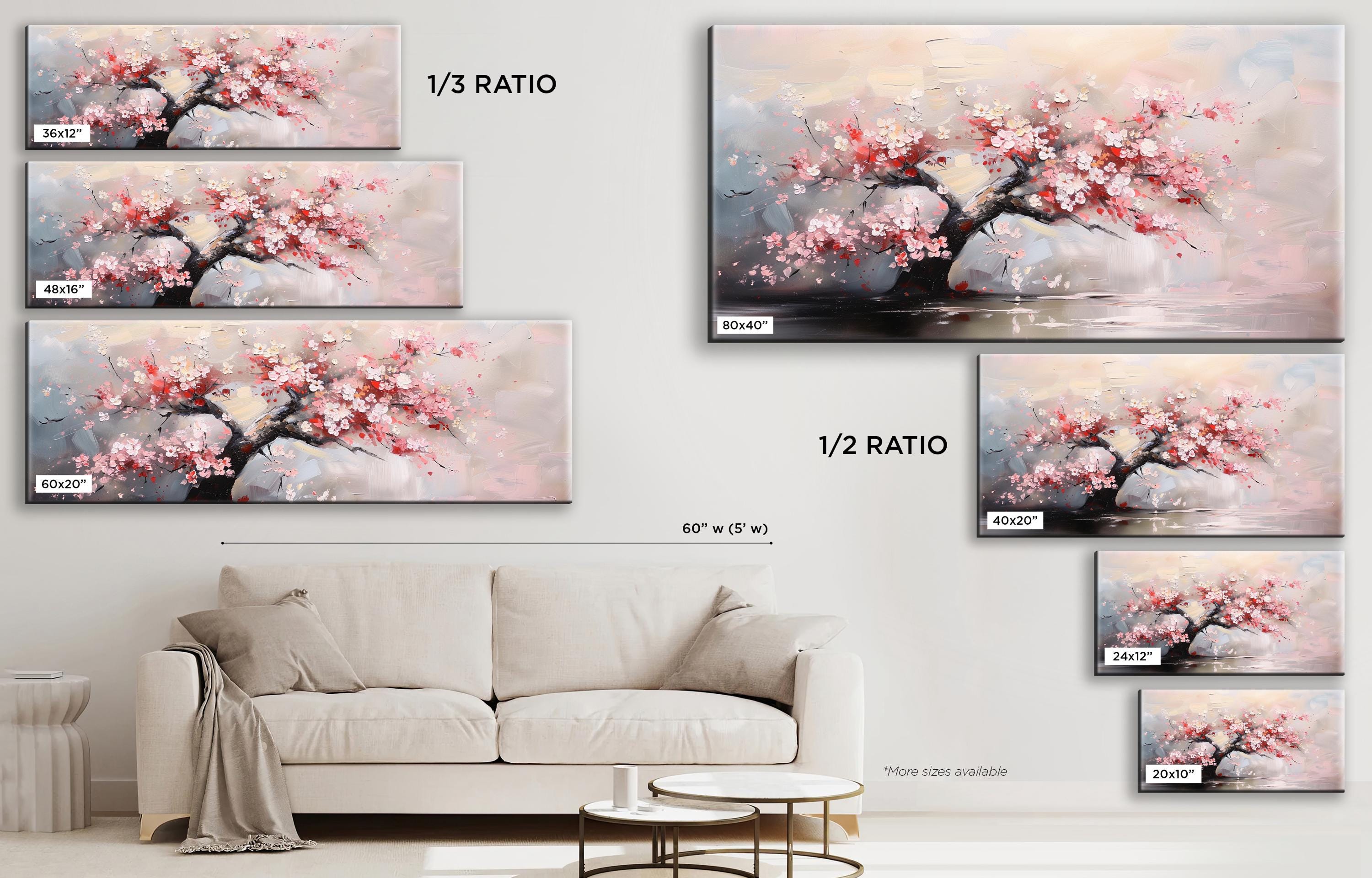 a living room with a white couch and a painting on the wall