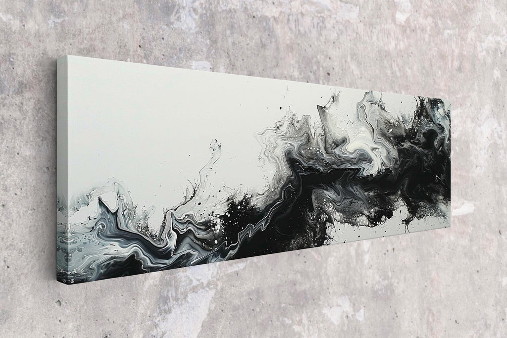 a black and white painting hanging on a wall
