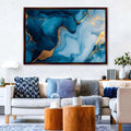 a living room filled with furniture and a painting on the wall