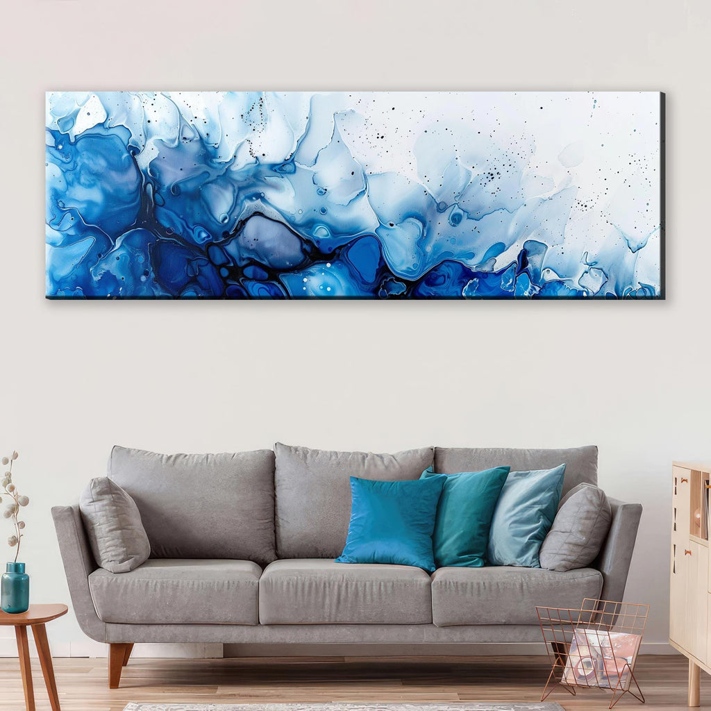 a living room with a couch and a painting on the wall