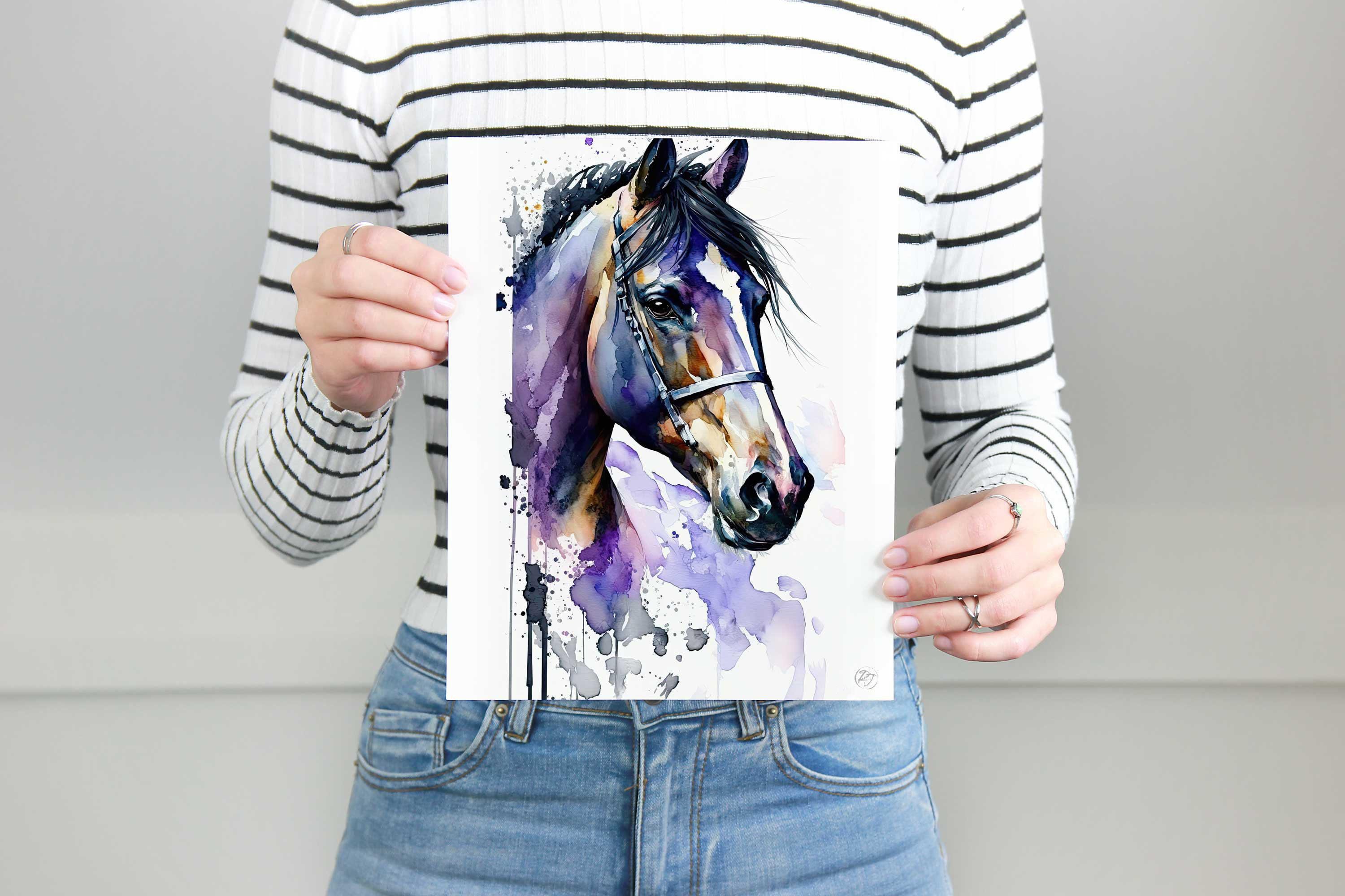 A person is holding up a framed print of a colorful watercolor painting of a horse's head.