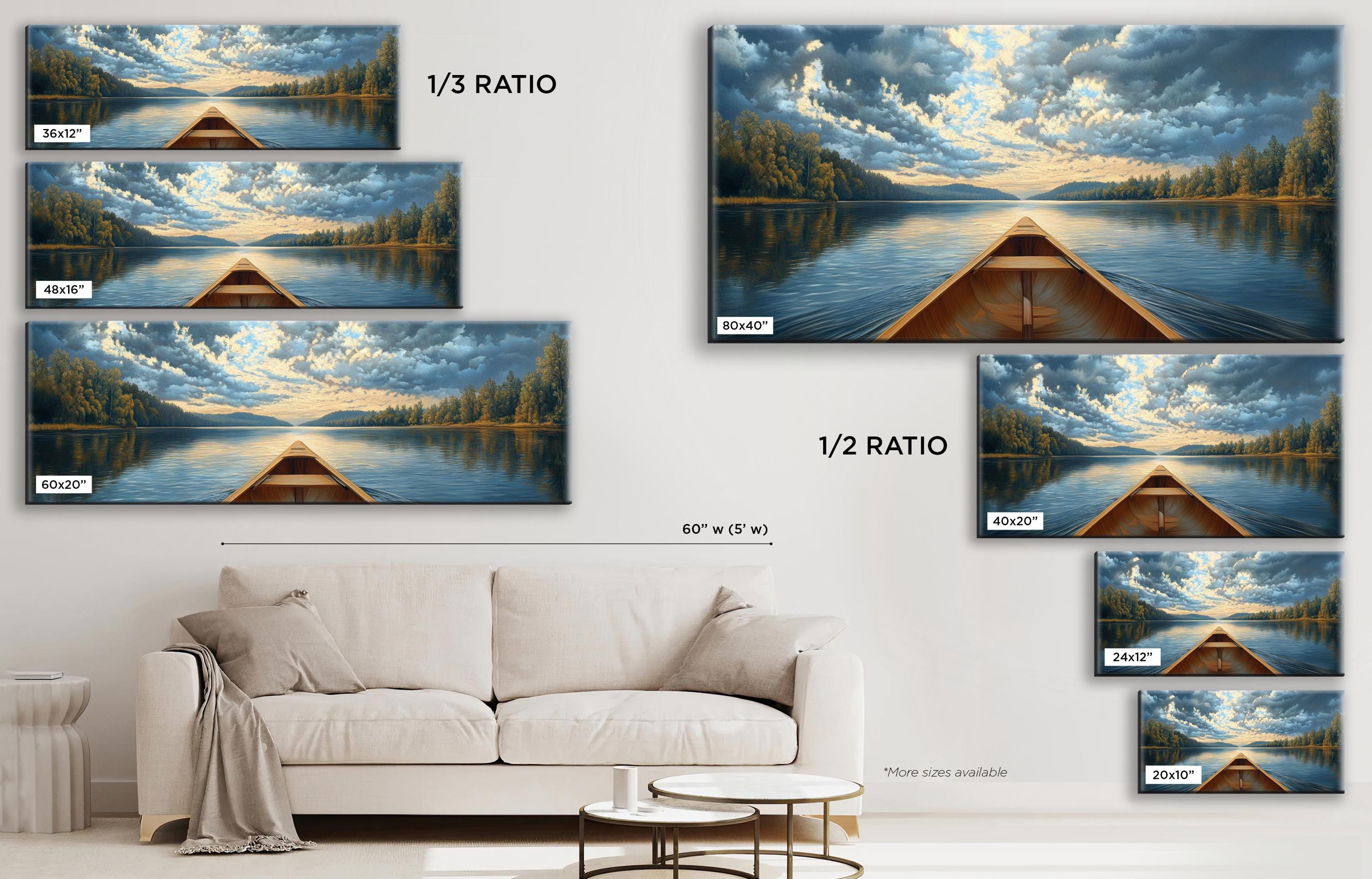 a living room with a white couch and a painting on the wall