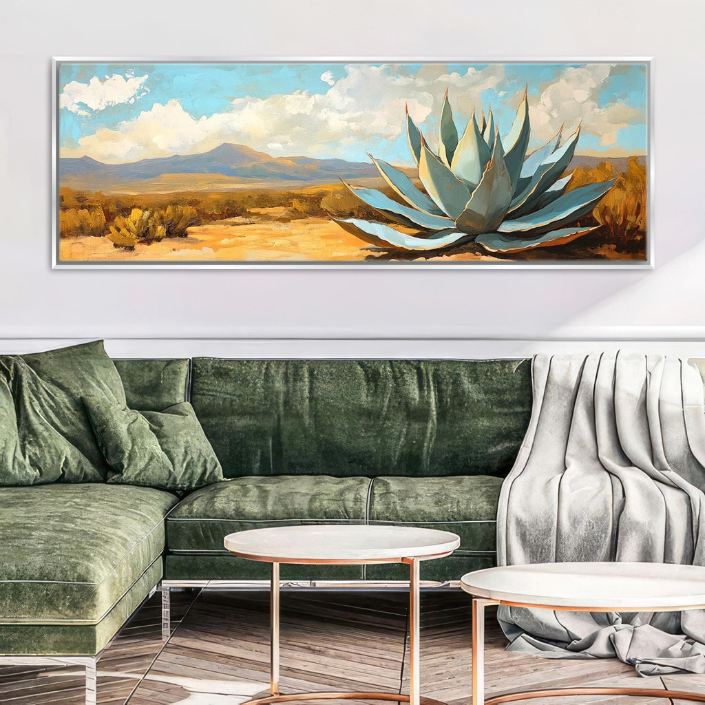 a living room with a green couch and a painting on the wall