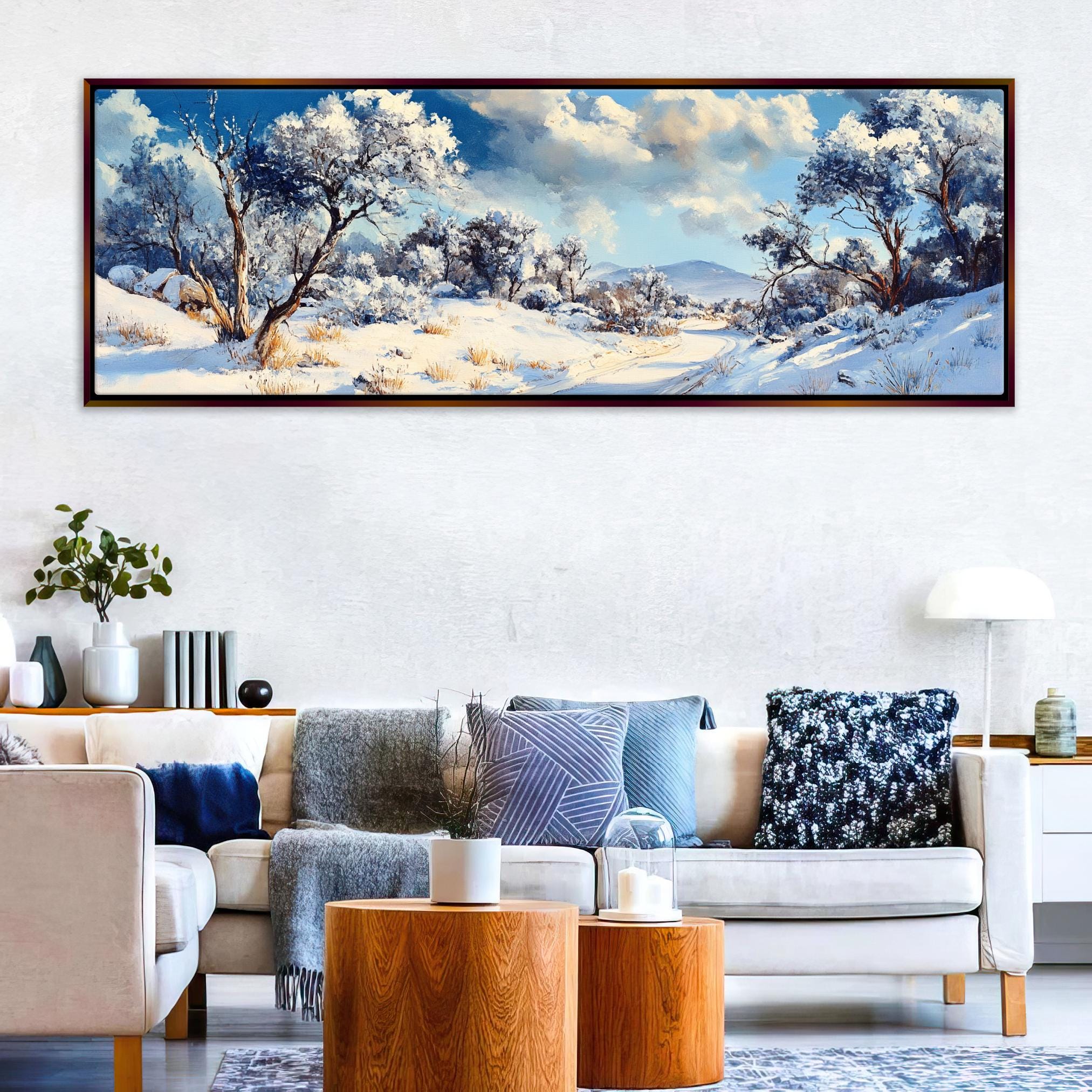 a living room with a couch and a painting on the wall