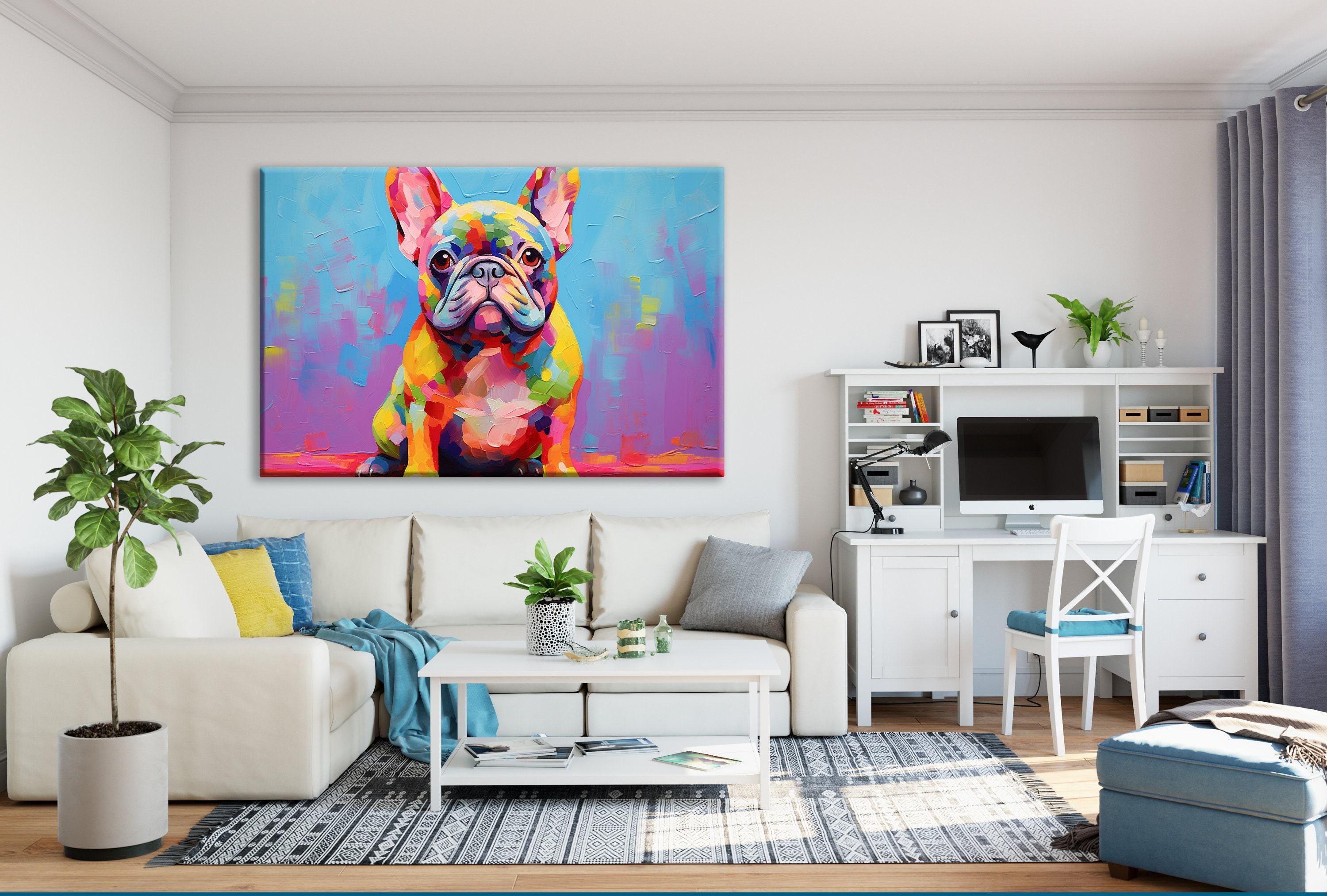 a living room with a large, colorful painting of a French Bulldog on the wall. The room has a white sofa, a coffee table, and a desk with a computer setup. There are also some decorative elements such as potted plants and a vase.