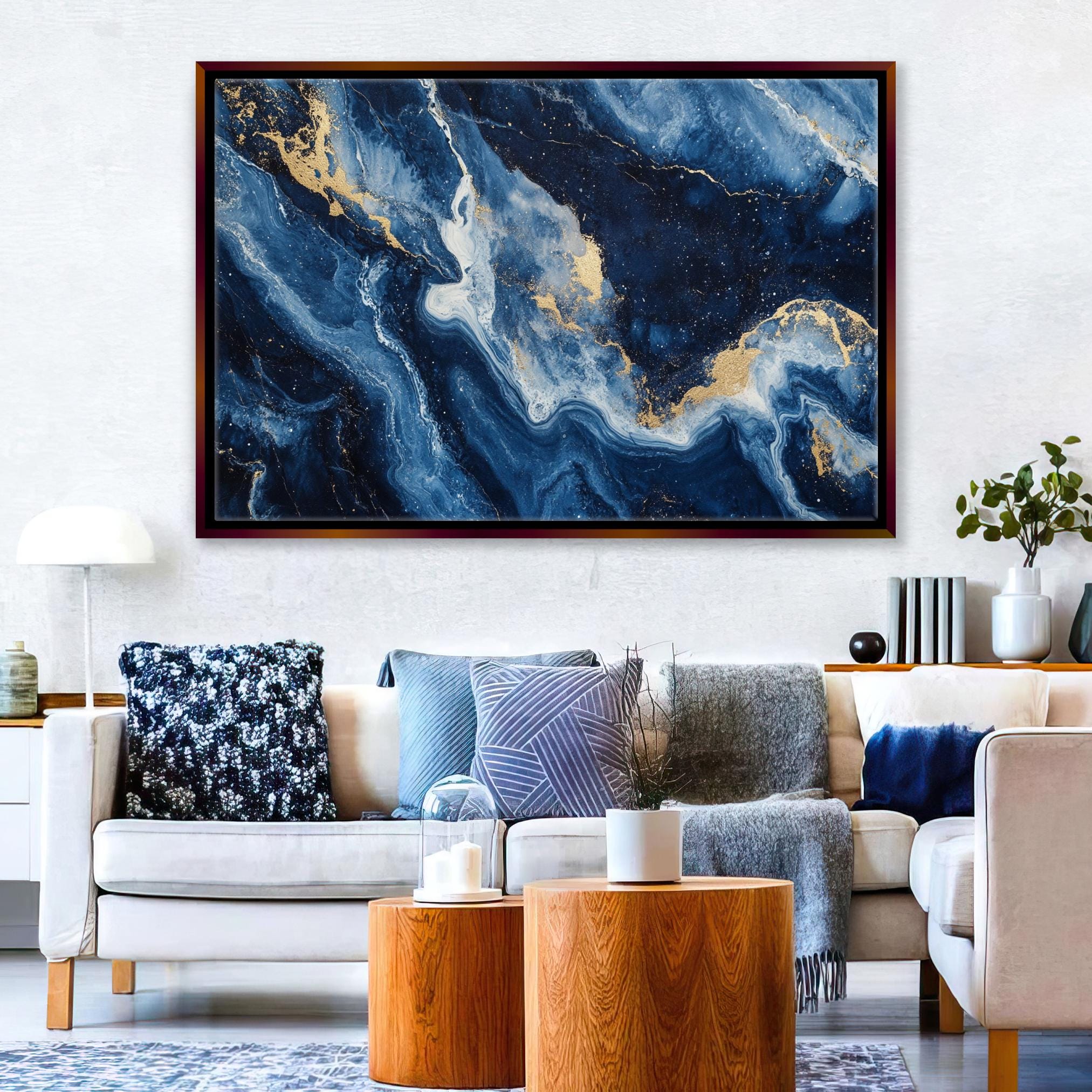 a living room filled with furniture and a painting on the wall